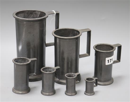 Seven graduated pewter tankards